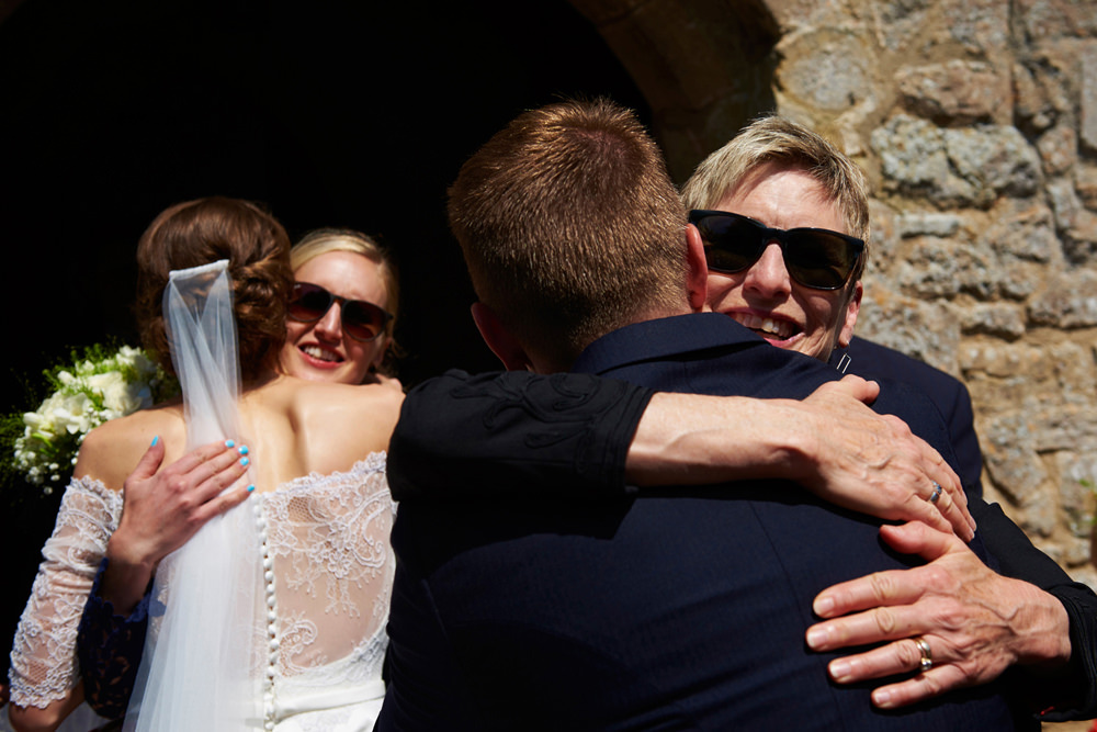 hugs for the bride and groom from guests