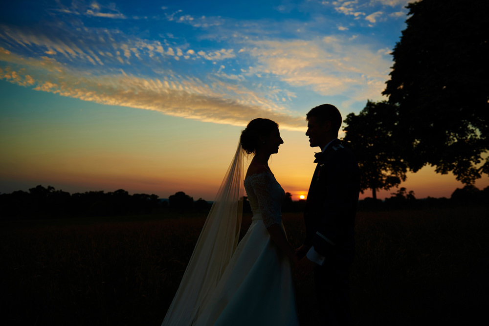 sunset shot of couple with lovely coloured sky