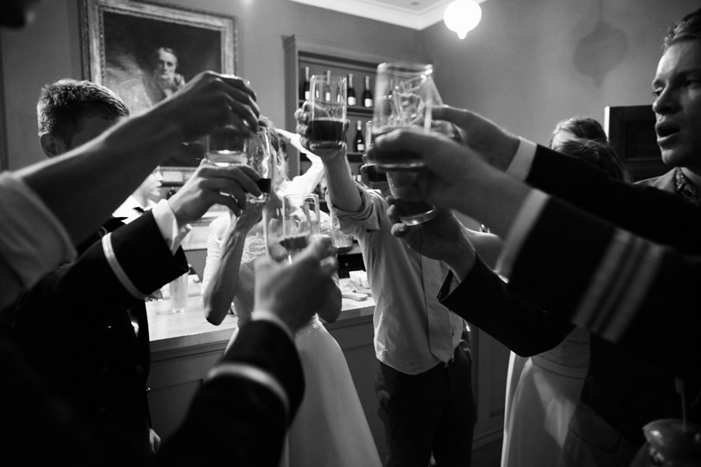 black and white image cheers of glasses