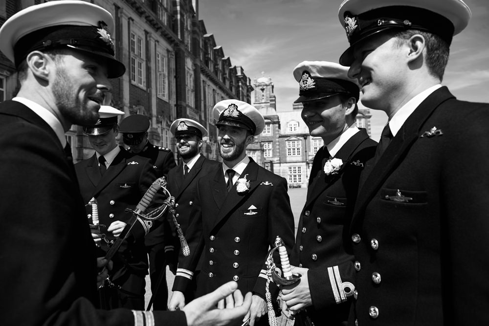 Royal Navy men in uniform laughing