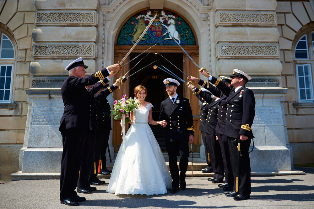 bride and groom under the swords in guard of honour