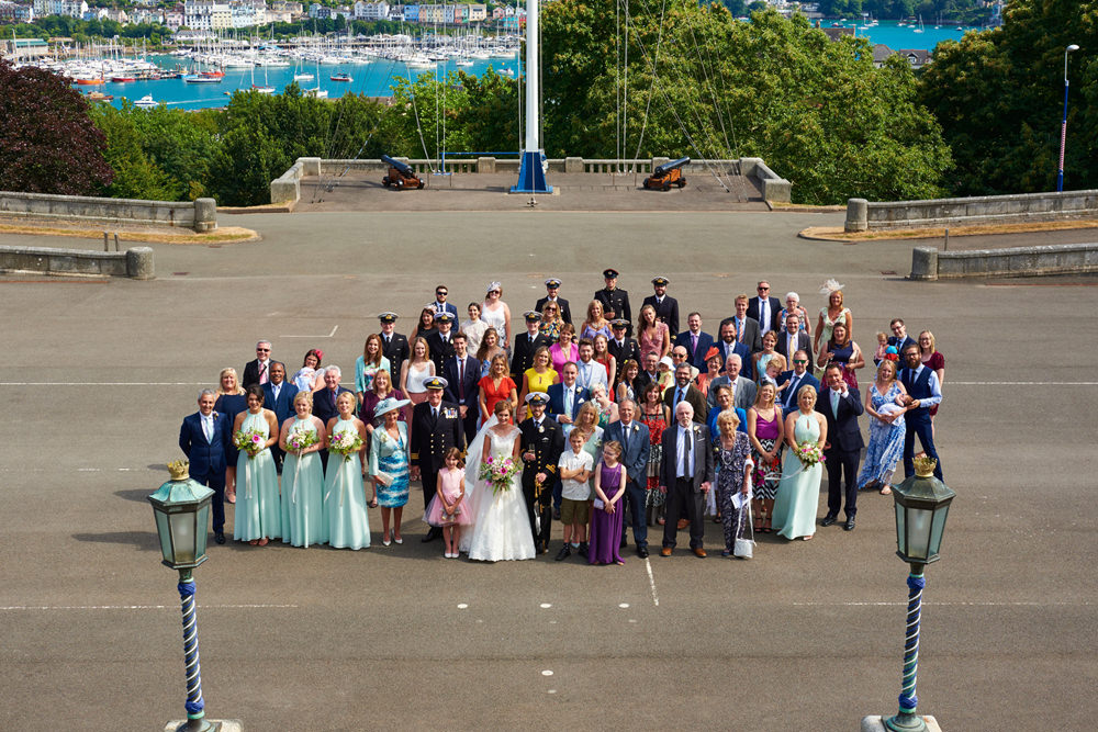 group shot of the whole wedding party outside the College in Dartmouth