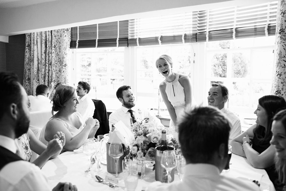 guest laughing at table