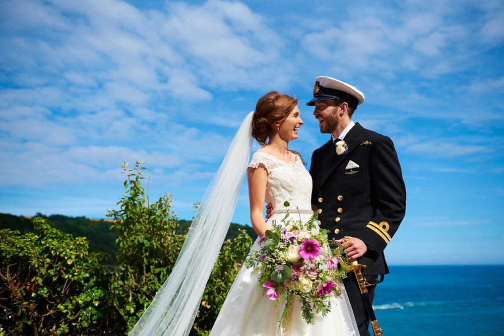 navy wedding in dartmouth with bride and groom and flowers