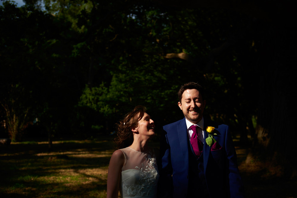 close up of bride and groom in dappled light